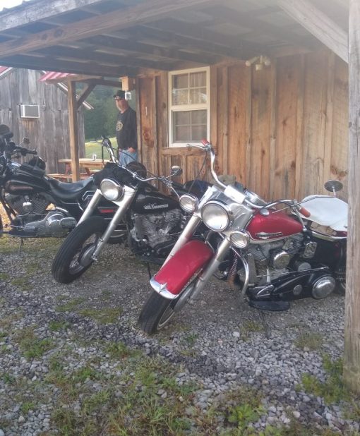 Parked Motorcycles Next to Lodge